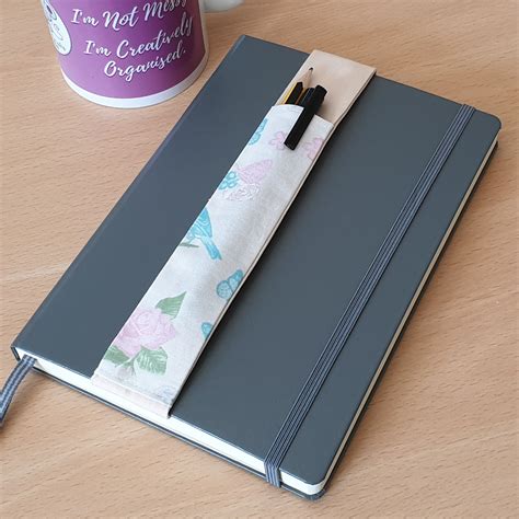 notepad with pen holder.